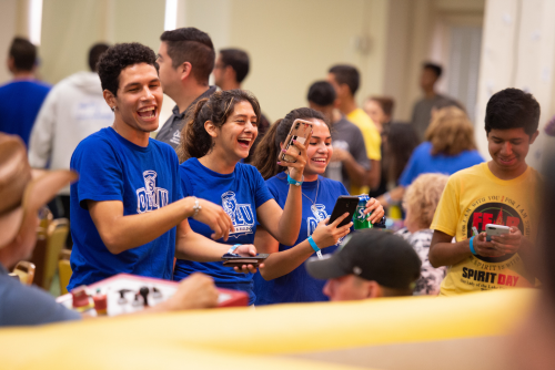 students laughing at a school event